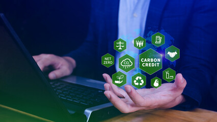 Green energy, Carbon credit market concept, Businessman holding Carbon credit icon, Net zero, Green...