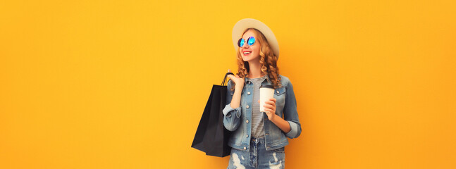 Shopping day! Stylish beautiful happy smiling young woman with black shopping bags, wear summer hat
