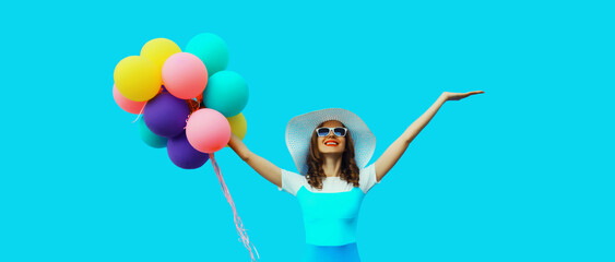 Summer, holiday, celebration, happy cheerful young woman with bright colorful balloons on blue