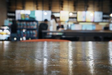 Blurred coffee shop counter with a warm inviting atmosphere.