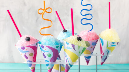 Fruit flavoured snow cones with crazy straws, ready for sharing.