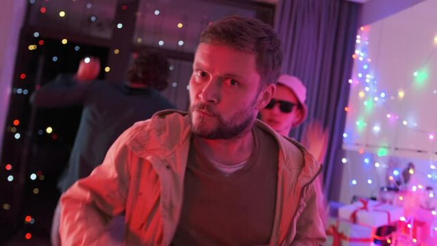 Medium shot of guys dancing during happy night party after end session and passed exams, birthday celebration.