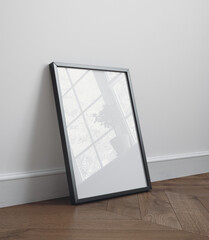 Black wooden frame poster mockup standing on the floor, 3d render