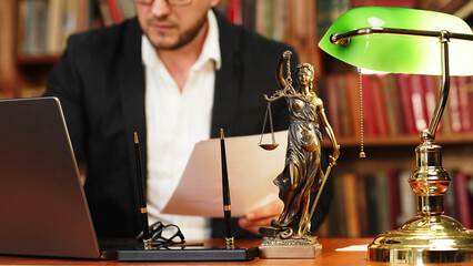 Close-up of a lawyer or judge's workplace with a fimida on the table. Concept of legal law, corruption and laws.