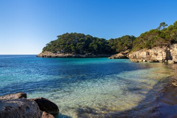 landscape view of the idyllic Cala Mitjana in southern Menorca