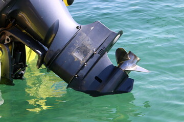 The propeller of a motor boat at the pier in the seaport.
