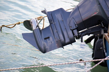The propeller of a motor boat at the pier in the seaport.