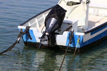 The propeller of a motor boat at the pier in the seaport.