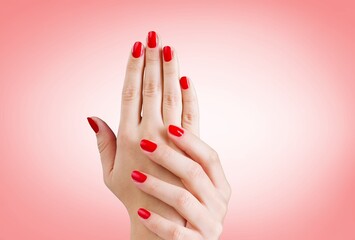 Womans hand with bright color manicure