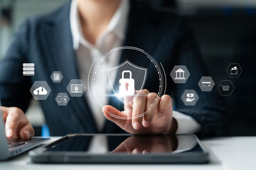 Securing cybersecurity, conducting online transactions, syncing and storing crucial data. businesswoman taps a lock icon to safeguard personal information on a tablet.