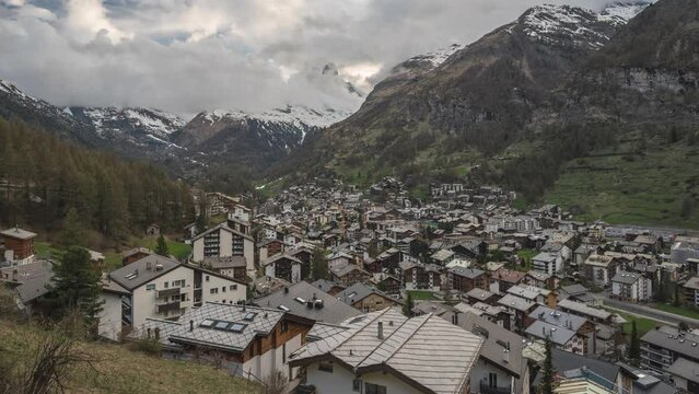 Zermatt Switzerland time lapse, city skyline dy to night at Valley and famous Matterhorn mountain peak