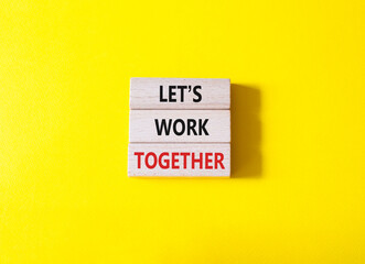 Lets work together symbol. Concept words Less is More on wooden blocks. Beautiful yellow background. Business and Less is More concept. Copy space.