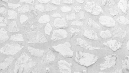 Empty monochrome black and white (light gray) embossed stone wall for abstract background and...