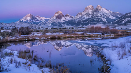 Alpenglow on mountain peaks with snow-covered ground and calm pond reflecting the serene landscape during twilight, soft studio lighting.