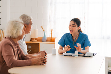 Fototapeta premium nursing home assistance in health insurance business concept, asian woman doctor or nurse caregiver support health care to elderly senior patient person, caretaker in medicals care recovery service