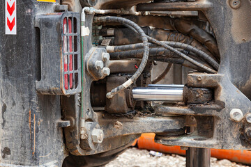 Hydraulic mechanisms of heavy loading equipment, close-up.