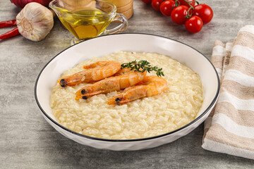 Italian risotto with prawn served thyme
