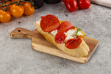 Bruschetta tapas with chorizo and tomato