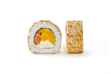 Sushi roll with salmon, cream cheese and mango in sesame
