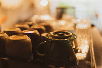 Professional Barista Prepares Fresh Cappuccino in a Busy Cafe: Closeup of Hands Skillfully Using...