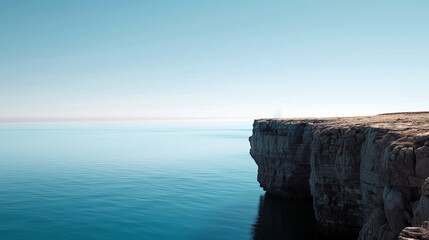 A beautiful blue ocean with a cliff in the background