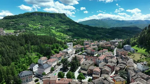 Aerial view of the town of Castelnovo ne' Monti located at the foot of the Bismantova Stone in the province of Reggio Emilia. Tuscan-Emilian Apennines, Italy