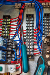blue wires connected to the contact strip and relays.