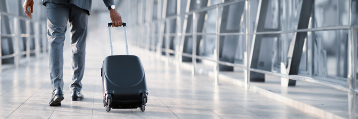 Cropped of African American Businessman At Airport Moving To Terminal Gate For Business Trip, Back...