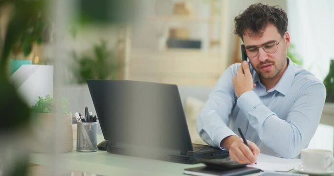 Busy Man Talking on Phone and Emailing