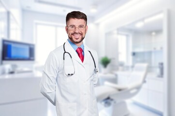 Professional young doctor posing in a dental clinic.