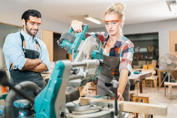 Fototapeta premium professional artisan carpenters woodworking team work together creatively, creative carpenter woman working workshop for wooden craft with wood tool at industry carpenter's shop, business of wood