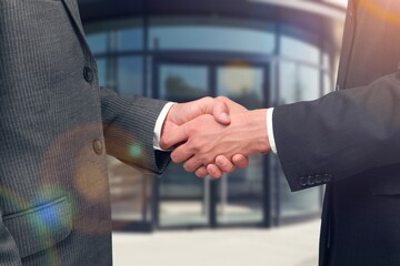 business team shaking hands, signing a contract.