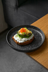 Toast with avocado and red caviar