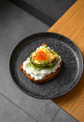 Toast with avocado and red caviar
