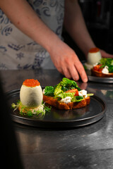 Caviar egg with toast and salad