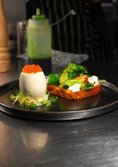 Caviar egg with toast and salad