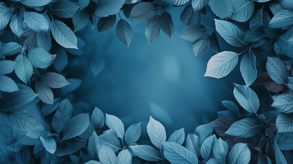 A blue background with leaves in the foreground