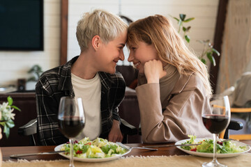 Warm passionate relationship between two lesbian girls going to kiss on romantic date. LGBT female...