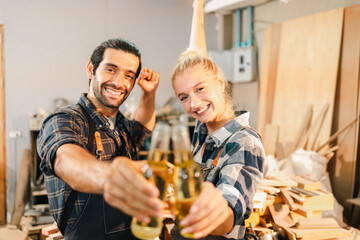 Attractive middle aged woman carpenter designer works with ruler, make notches on the tree in workshop. Image of modern femininity. Concept of professionally motivated women