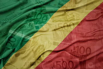 waving colorful national flag of republic of the congo on a euro money banknotes background. finance concept.