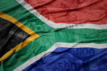 waving colorful national flag of south africa on a euro money banknotes background. finance concept.