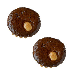 Two brownies with a hole in the middle. The brownies are sitting on a white background