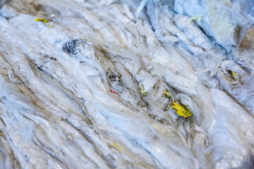 Stacked piles of plastic film watse for recycling. Waste management and ecology