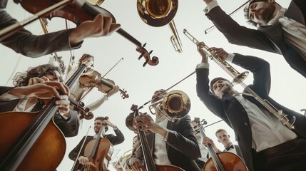 The image shows a group of musicians playing their instruments. They are all looking down at the...