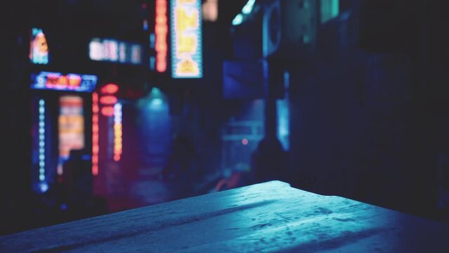 small street with neon restaurants at night