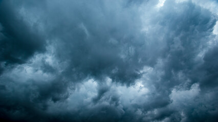 Bad or moody weather sky and environment. climate change. carbon dioxide emissions, greenhouse effect, global warming.The dark sky with heavy clouds converging and a violent storm before the rain.