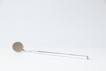Dental mirror on white background