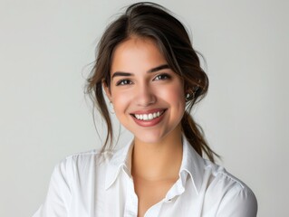 Stylish young brunette woman smiling on a white background. Beauty and fashion. Style.