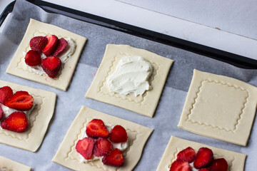 Puffs with strawberries and strawberries. The process of making summer dessert