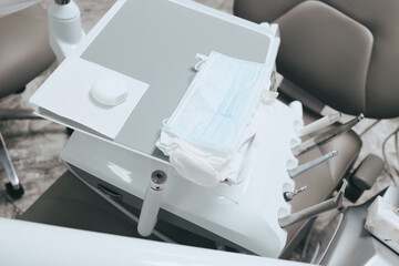 Various dental instruments and instruments in the dentist's office. Modern metal dental instruments and polishers on the dentist's chair in a dental clinic.